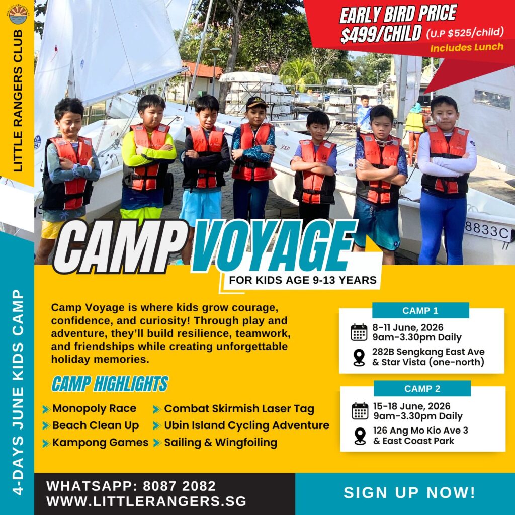 Kids aged 9-13 in life jackets, smiling and posing at Camp Voyage, surrounded by sailboats, promoting outdoor adventures and teamwork activities at Little Rangers Club holiday camp.